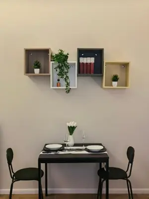 a dining table with two chairs and a table with two glasses at Metro Lodi Apartment in Rome