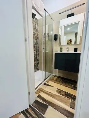 a bathroom with a shower and a sink at SD Vatican Rooms in Rome