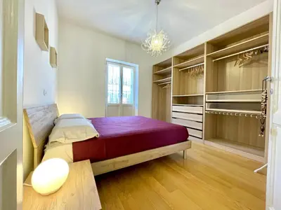 a bedroom with a large bed in a room at Vittoria's home in Rome