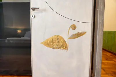 a door with a leaf etched into it at Green Hill Rome Suite Home in Rome