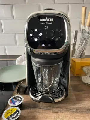 a black coffee maker sitting on a kitchen counter at Green Hill Rome Suite Home in Rome