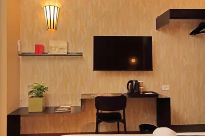 a room with a bar with a television on a wall at Habito Suites in Rome