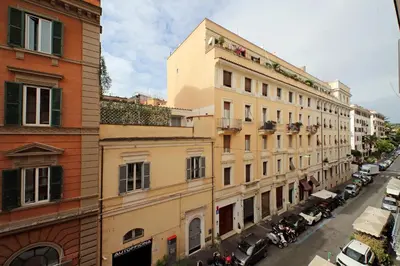 a view of a city street with buildings and cars at Habito Suites in Rome