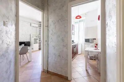 an open door to a kitchen with a table and chairs at Casa Lodi Roma by Hili in Rome
