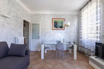 a living room with a table and a couch at Casa Lodi Roma by Hili in Rome