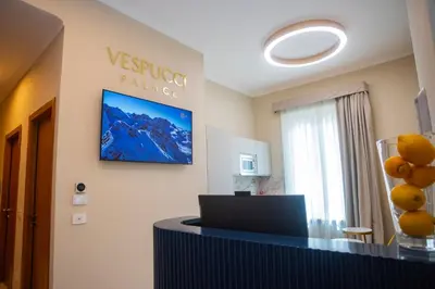 an office with a desk and a sign on the wall at Vespucci Palace Roma in Rome