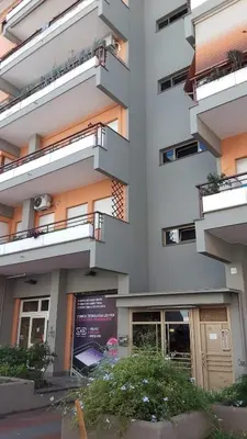 a building with balconies on the side of it at Saluzzo Apartment in Rome