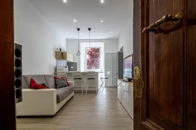 a living room with a couch and a table at St Peter Family Stay in Rome