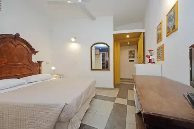 a bedroom with a large bed and a table at Cavour in Rome
