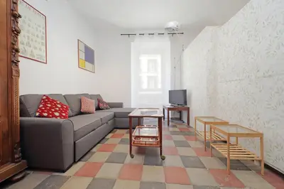a living room with a couch and a tv at Cavour in Rome