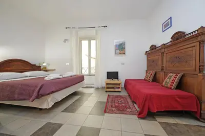 a bedroom with two beds and a television in it at Cavour in Rome