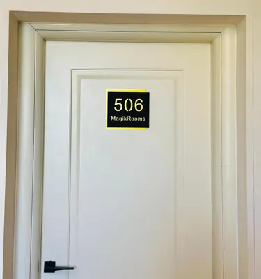 a door with a sign on it that reads magnification at Magikrooms Topaz in Rome