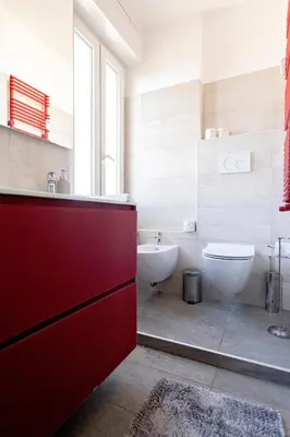 a bathroom with a sink and a toilet and a tub at Ion Apartment in Rome