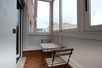two benches in a room with windows at Francesca e Anita in Rome