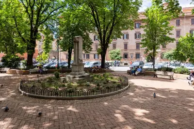 a fountain in a park with birds around it at Brevi Roma Design Apartment in Rome