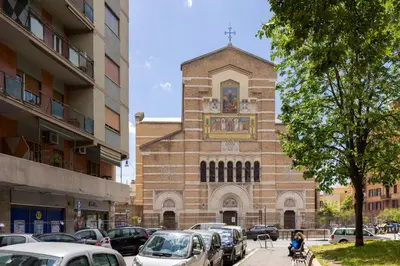 a church with cars parked in front of it at Brevi Roma Design Apartment in Rome