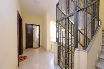 a hallway with a door with a metal gate at Vatican Claudia's apartment in Rome