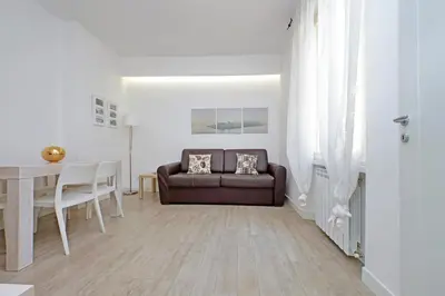 a living room with a couch and a table at Vatican Claudia's apartment in Rome
