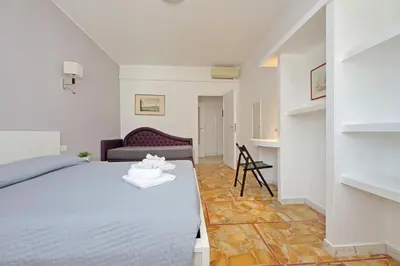 a living room with a bed and a bedroom at St Peter Sanctuary Retreat Spacious 120 mq Apartment Vatican in Rome