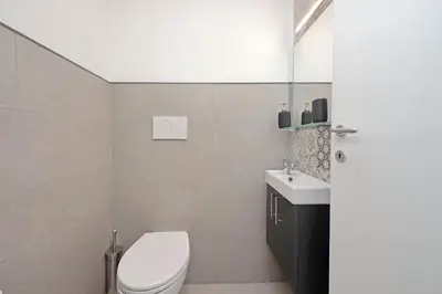 a bathroom with a toilet and a sink at St Peter Sanctuary Retreat Spacious 120 mq Apartment Vatican in Rome