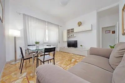a living room with a couch and a table at St Peter Sanctuary Retreat Spacious 120 mq Apartment Vatican in Rome