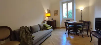 a living room with a couch and a table at Casa Ponte della Musica in Rome