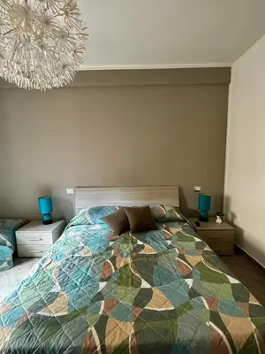 a bedroom with a bed and a chandelier at Residenza Cenci in Rome