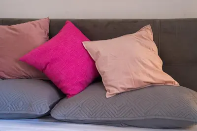 four pillows sitting on top of a couch at Carpegna Sweet House - A few stops from the city centre in Rome