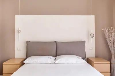 a bedroom with a large bed with two night stands at Vatican Flat in Rome