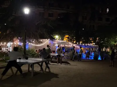 a group of people at an outdoor market at night at Rome Jubilee Stays in Rome