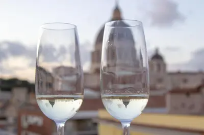 two wine glasses sitting on top of a table at The Aristocats Apartment in Rome