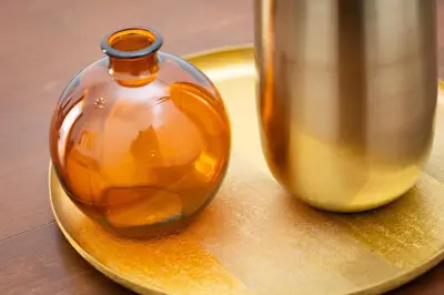 a glass vase sitting on a plate next to access at Pietroburgo by Rental in Rome in Rome