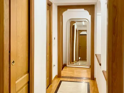 a hallway with a mirror and a rug at DaliTourism - Colosseo Prestige Apartment in Rome