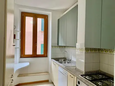 a kitchen with a sink and a window at DaliTourism - Colosseo Prestige Apartment in Rome