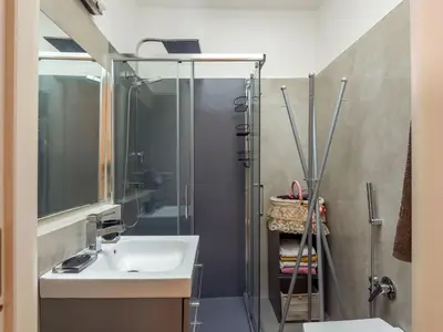 a bathroom with a sink and a shower at Apartment Tiziano by Interhome in Rome