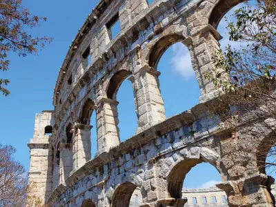 ancient ruins of a building with arches at Apartment Charming Terrace by Interhome in Rome
