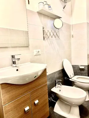 a bathroom with a sink and a toilet at Casa Carlotta a Roma in Rome