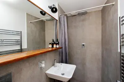a bathroom with a sink and a mirror at Charming Minerva - My Extra Home in Rome