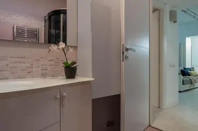 a kitchen with a sink and a refrigerator at DiTullio18 - Cipro Balduina in Rome