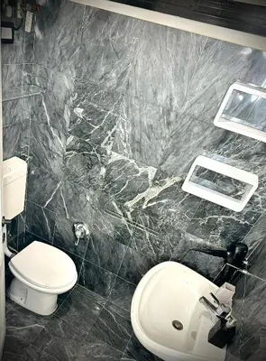 a bathroom with a toilet and a sink at Rinascita Vatican Home in Rome