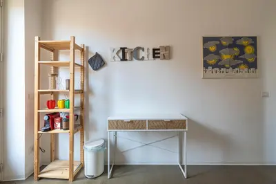 a desk and a shelf in a room at Il Cupolone 3 camere a San Pietro in Rome