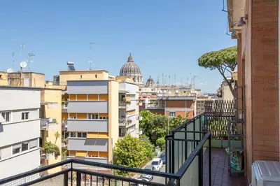 a balcony with a view of a city at Il Cupolone 3 camere a San Pietro in Rome