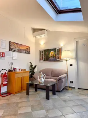 a bedroom with a bed with folded towels on it at Attic Garden in Rome