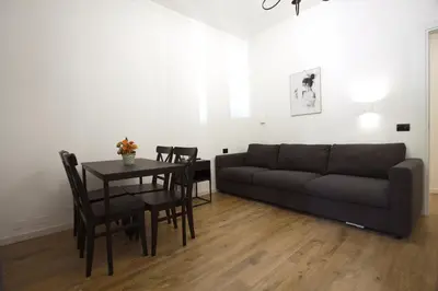 a living room with a couch and a table at Milizie Holiday House in Rome