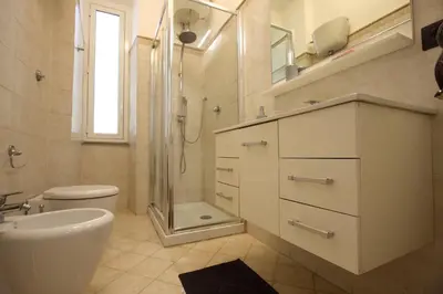 a bathroom with a sink toilet and a shower at Milizie Holiday House in Rome
