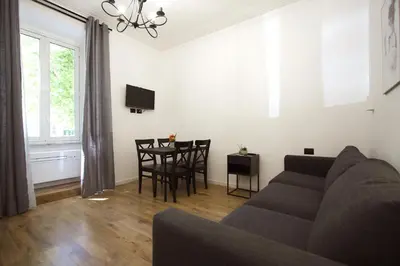 a living room with a couch and a table at Milizie Holiday House in Rome