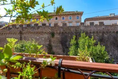 a brick wall with a building on top of it at iFlat Peaceful apt with terrace next to Vatican in Rome