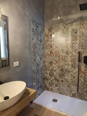 a bathroom with a white sink and a shower at Think House in Rome