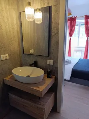 a bathroom with a bath tub on a wooden table at Think House in Rome