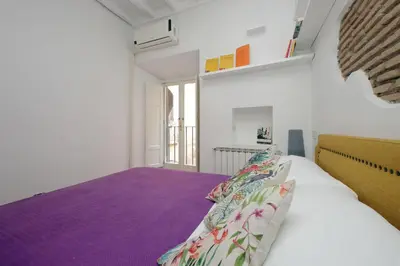 a bedroom with a large bed with purple sheets at Cappellari37 in Rome